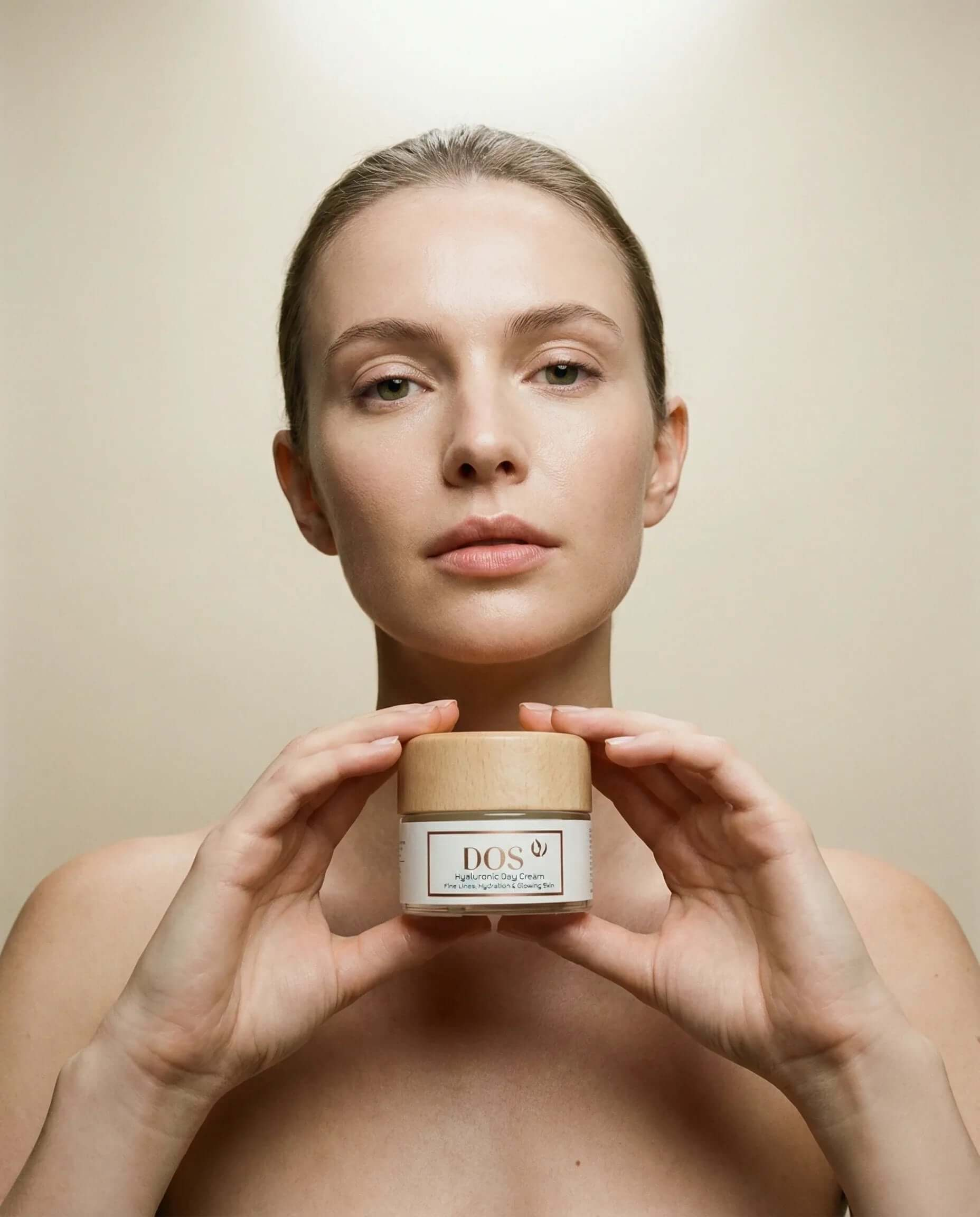 Hyaluronic day cream held by a woman showcasing deep hydration and antioxidant protection for healthy skin. DOS Cosmetics