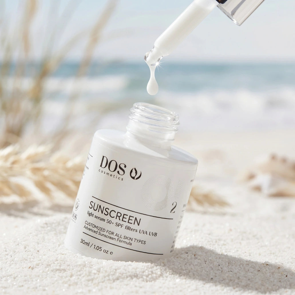DOS Sunscreen serum with dropper on a beach background 50SPF Antispot