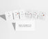 Six small white skincare sachets arranged in a row on a light gray background, with a white card in front reading &